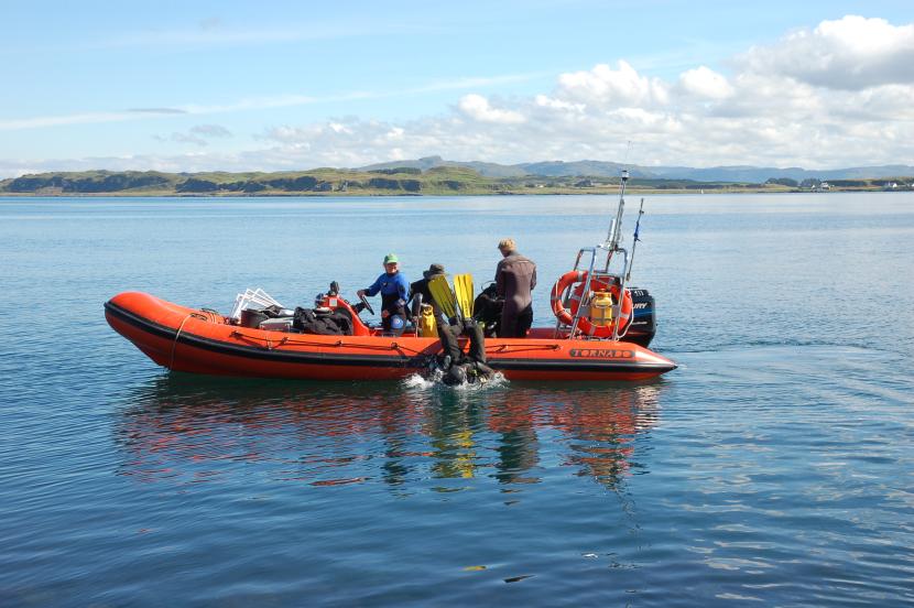 Diver entering the water from NatureScot RIB Aphrodite.