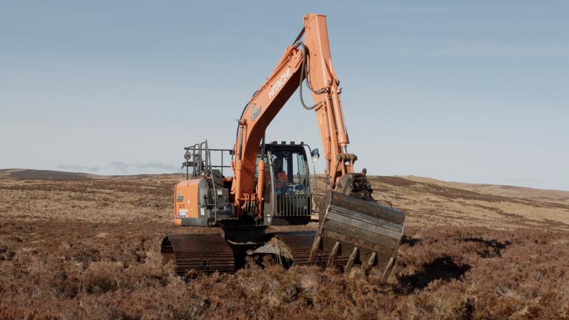 Machine operator blocking a ditch