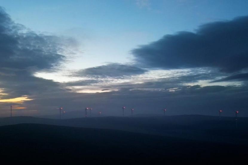drone image of aviation lighting on wind turbines