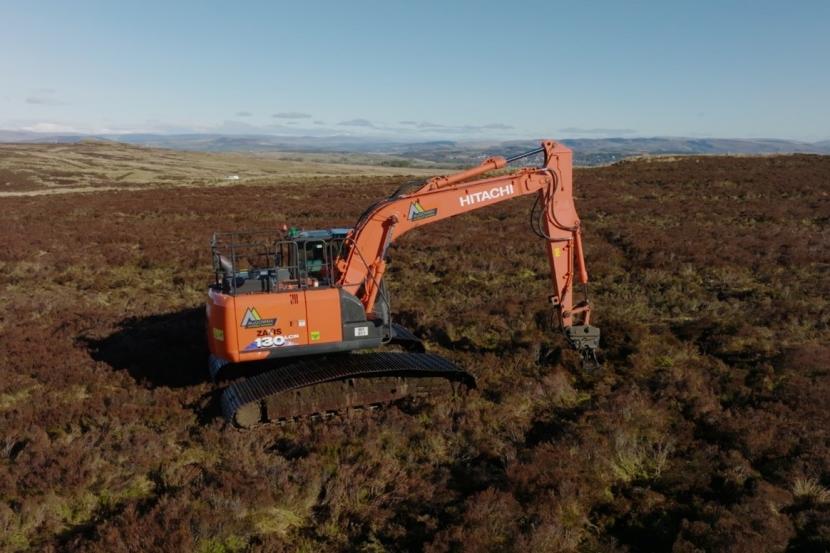 A digger in action restoring drained peatland ©Peatland ACTION/Swift Films.