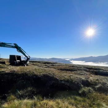 A digger on a hill