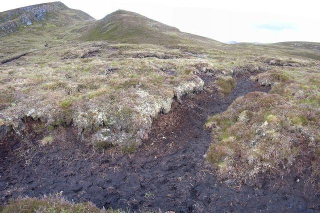 Upland habitats in Ben Wyvis SAC, showing damage to the hillside.